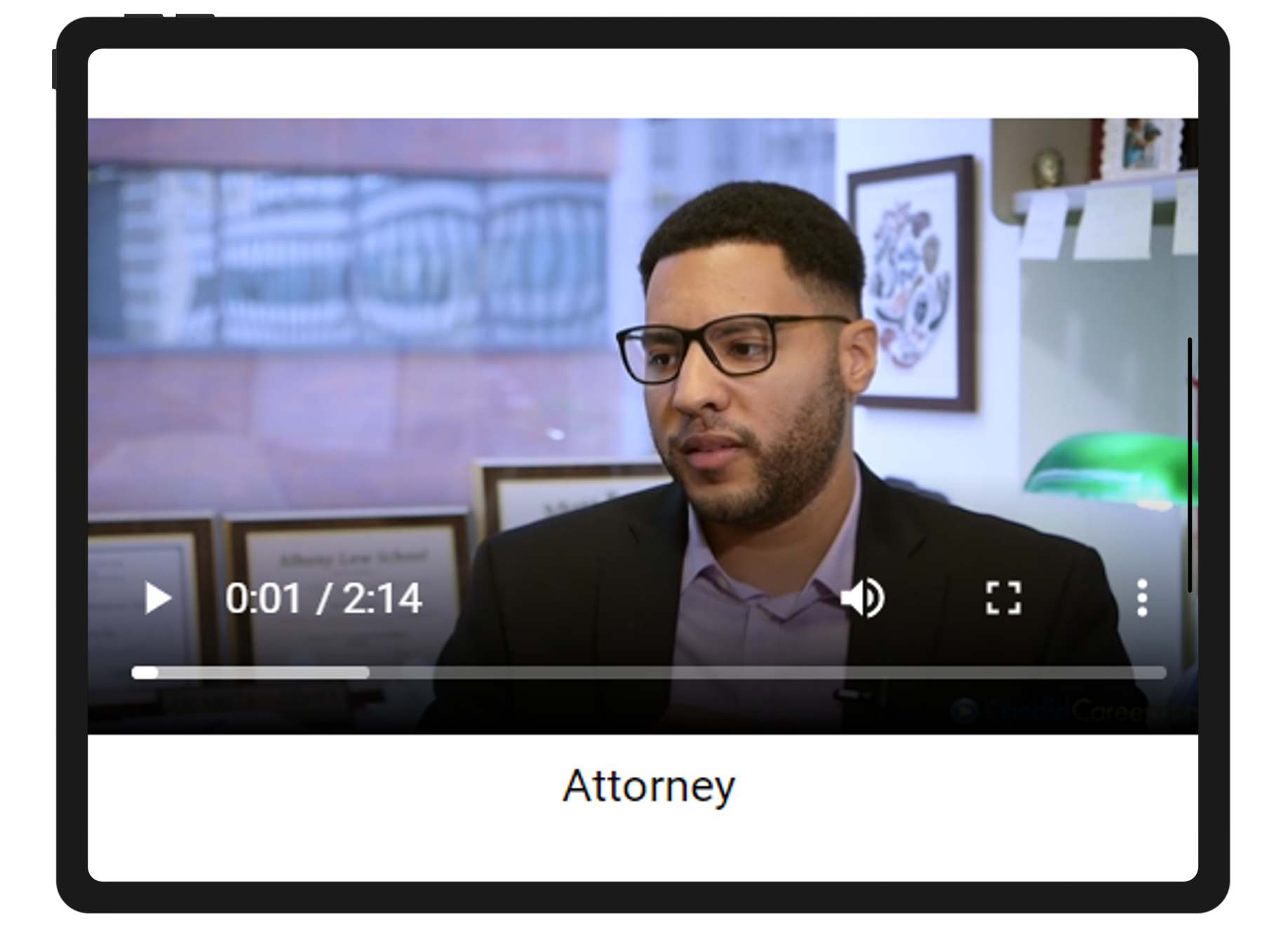 0:01 /, Attorney. Man in black suit jacket wearing black framed eyeglasses